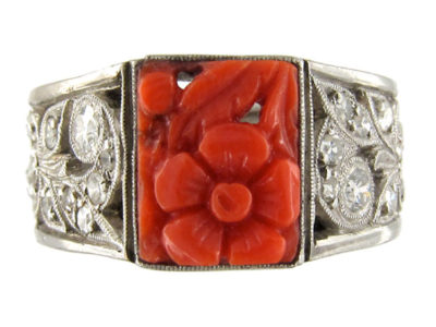 Carved Coral Ring with Diamond Sides Set in Platinum