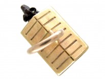 Gold Dog in Kennel Charm