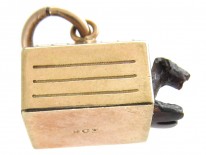 Gold Dog in Kennel Charm
