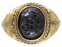 Victorian Gold Ring with a Carved Garnet of a Cherub's Head