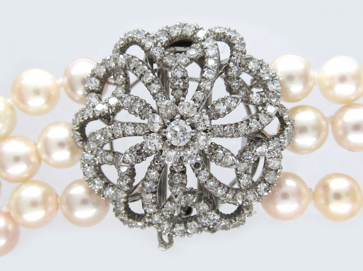 Cultured Pearl Three Strand Necklace with Large Diamond Set Flower Clasp