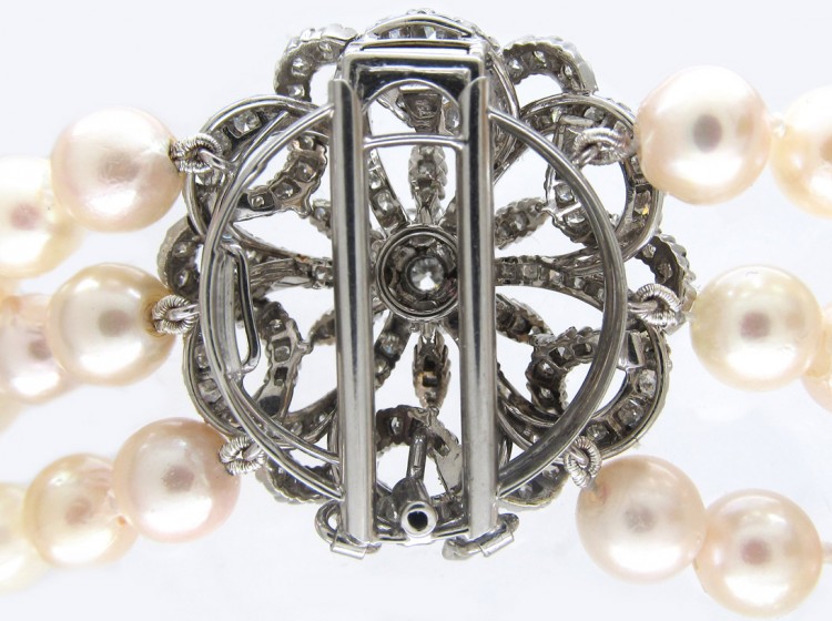 Cultured Pearl Three Strand Necklace with Large Diamond Set Flower Clasp