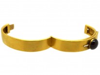 Victorian 18ct Gold Buckle Design Bangle Set With a Cabochon Garnet