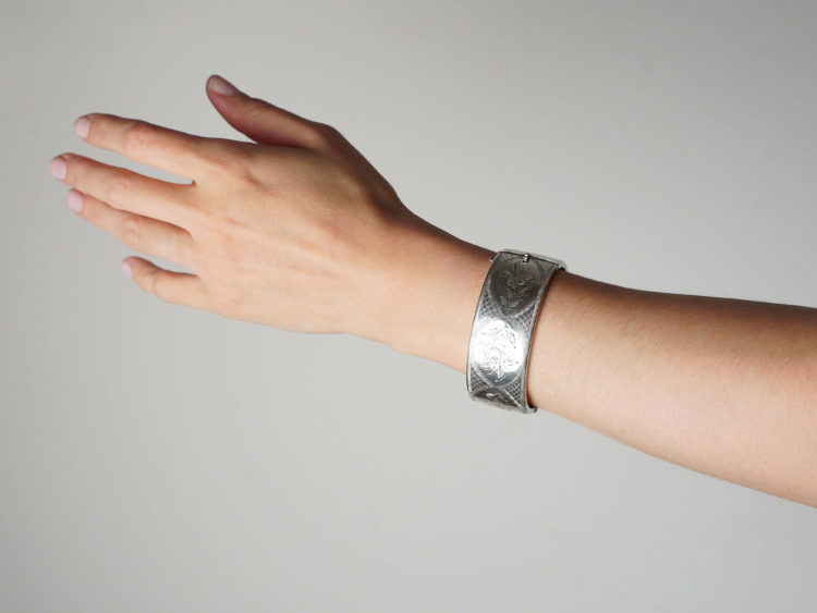 Silver Bangle With Engraved Flower Motif