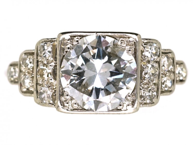 Palladium Single Stone Diamond Ring With Stepped Diamond Shoulders
