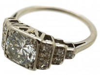 Palladium Single Stone Diamond Ring With Stepped Diamond Shoulders