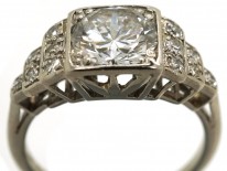 Palladium Single Stone Diamond Ring With Stepped Diamond Shoulders