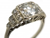 Palladium Single Stone Diamond Ring With Stepped Diamond Shoulders