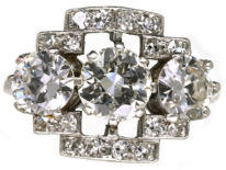 Art Deco Platinum & Three Stone Diamond Ring Within a Geometric Setting