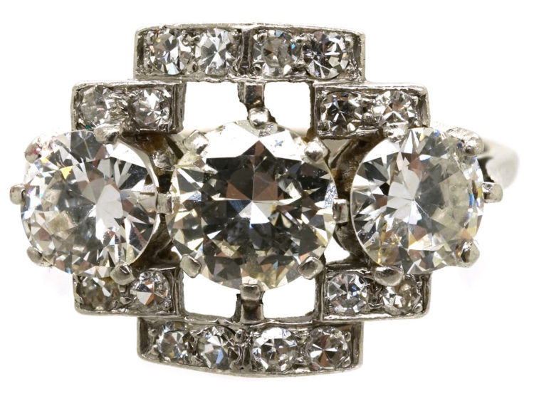 Art Deco Platinum & Three Stone Diamond Ring Within a Geometric Setting