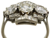 Art Deco Platinum & Three Stone Diamond Ring Within a Geometric Setting