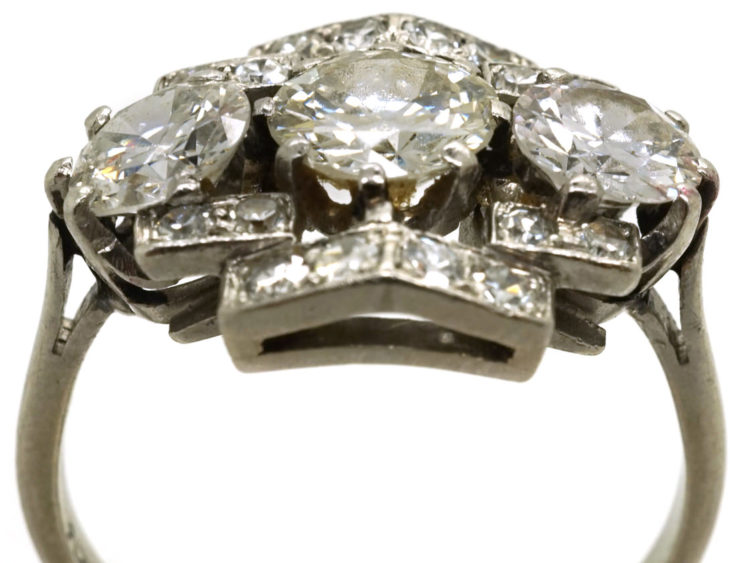 Art Deco Platinum & Three Stone Diamond Ring Within a Geometric Setting