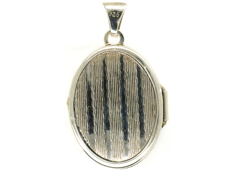 Small Silver Oval Locket With Flower Decoration