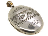 Victorian Oval Silver Locket With Entwined Ribbon Design