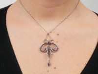 Art Deco Platinum, Sapphire & Diamond Bow Design Pendant on Platinum Chain