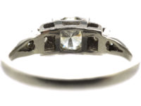Art Deco Platinum Diamond Solitaire Ring with Step Cut Diamond Set Shoulders