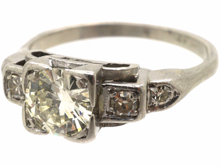 Art Deco Platinum Diamond Solitaire Ring with Step Cut Diamond Set Shoulders