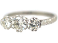 Art Deco Platinum, Three Stone Diamond Ring with Engraved Floral Shank