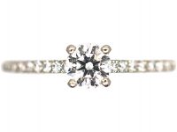 Platinum & Diamond Solitaire Ring with Diamond Set Shoulders by De Beers