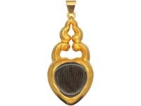 Victorian 15ct Gold Heart Shaped Pendant set with a Cabochon Garnet