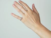 Art Deco Platinum, Diamond Solitaire Ring with Step Cut Shoulders set with Diamonds