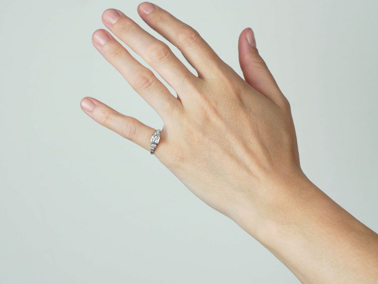 Art Deco Platinum, Diamond Solitaire Ring with Step Cut Shoulders set with Diamonds