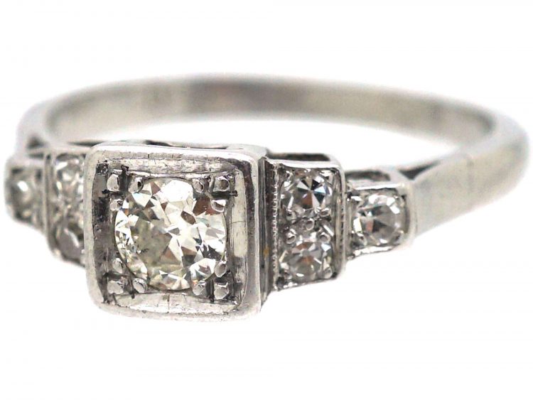 Art Deco Platinum, Diamond Solitaire Ring with Step Cut Shoulders set with Diamonds