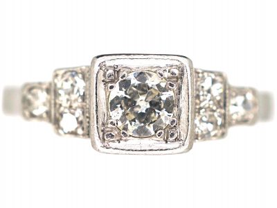 Art Deco Platinum, Diamond Solitaire Ring with Step Cut Shoulders set with Diamonds