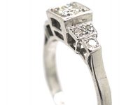 Art Deco Platinum, Diamond Solitaire Ring with Step Cut Shoulders set with Diamonds
