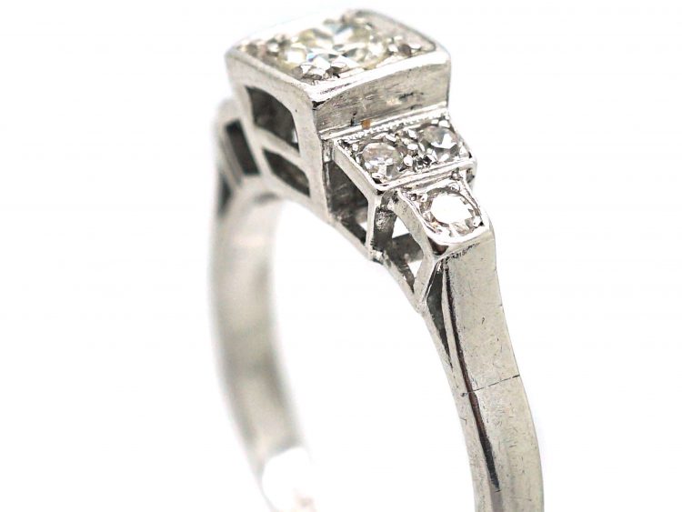 Art Deco Platinum, Diamond Solitaire Ring with Step Cut Shoulders set with Diamonds