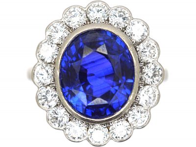 Platinum, 4.10 carat Sapphire & Diamond Oval Cluster Ring