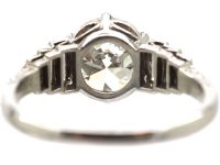 Art Deco Platinum, Transitional Cut Diamond Solitaire Ring with Step Cut Shoulders set with Baguette Diamonds