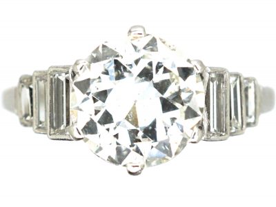 Art Deco Platinum, Transitional Cut Diamond Solitaire Ring with Step Cut Shoulders set with Baguette Diamonds