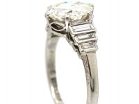 Art Deco Platinum, Transitional Cut Diamond Solitaire Ring with Step Cut Shoulders set with Baguette Diamonds