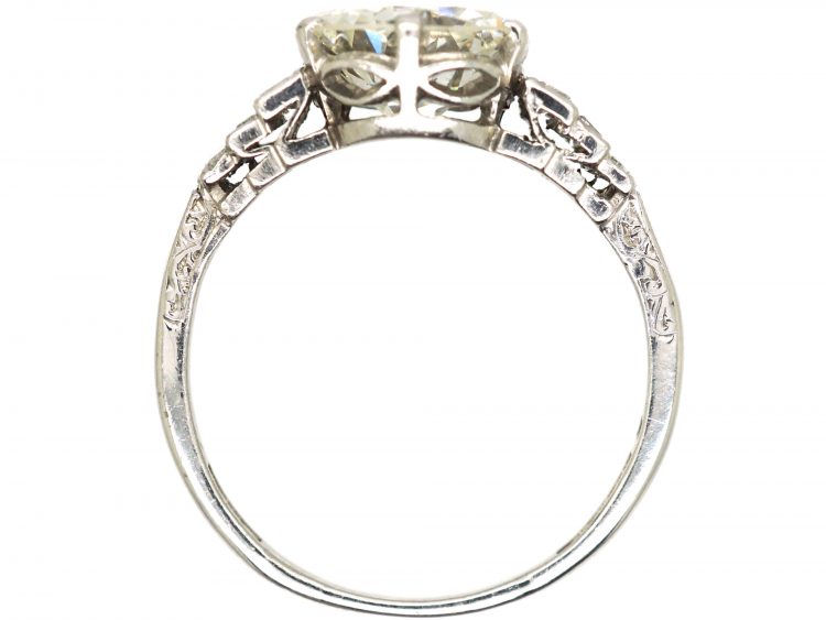 Art Deco Platinum, Transitional Cut Diamond Solitaire Ring with Step Cut Shoulders set with Baguette Diamonds