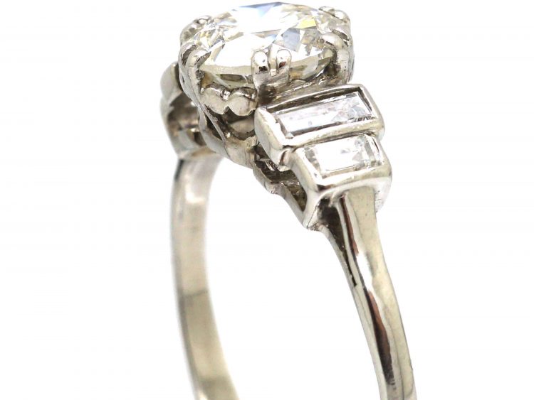 Art Deco Platinum, Diamond Solitaire Ring with Stepped Shoulders set with Baguette Diamonds