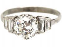 Art Deco Platinum, Diamond Solitaire Ring with Stepped Shoulders set with Baguette Diamonds