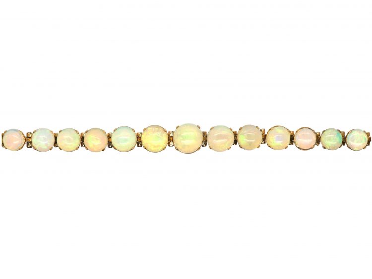 Retro 9ct Gold Bracelet set with a Line of Graduated Opals