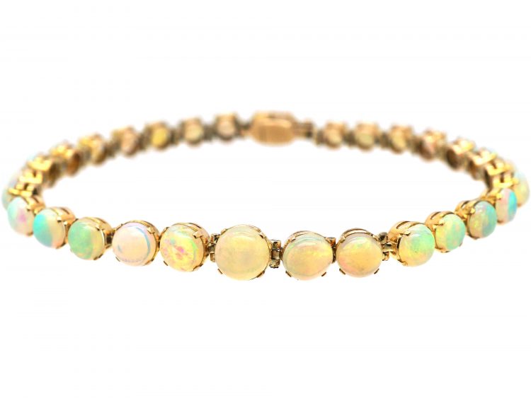 Retro 9ct Gold Bracelet set with a Line of Graduated Opals