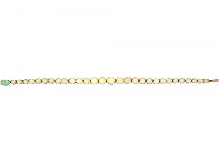 Retro 9ct Gold Bracelet set with a Line of Graduated Opals