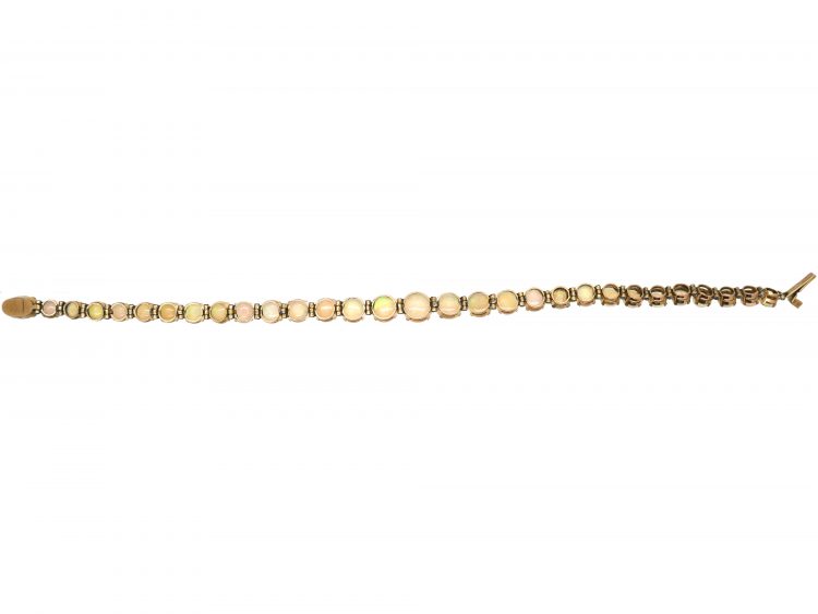 Retro 9ct Gold Bracelet set with a Line of Graduated Opals