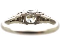 Art Deco Platinum Solitaire Diamond Ring with Step Cut Shoulders set with Diamonds