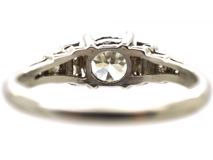 Art Deco Platinum Solitaire Diamond Ring with Step Cut Shoulders set with Diamonds