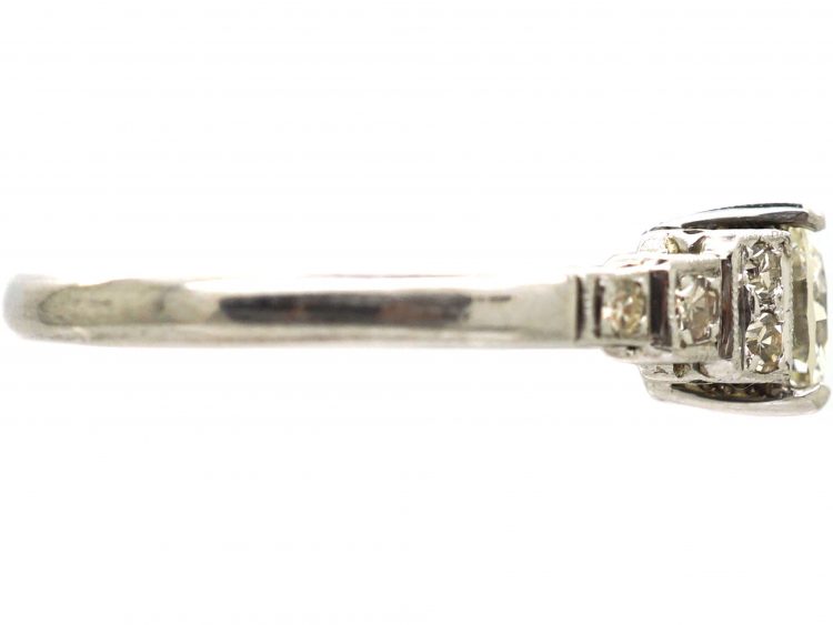 Art Deco Platinum Solitaire Diamond Ring with Step Cut Shoulders set with Diamonds