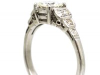 Art Deco Platinum Solitaire Diamond Ring with Step Cut Shoulders set with Diamonds