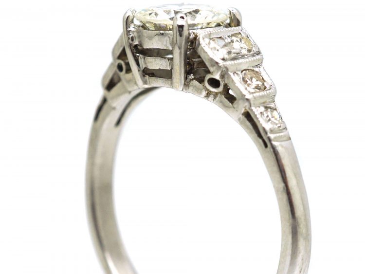 Art Deco Platinum Solitaire Diamond Ring with Step Cut Shoulders set with Diamonds
