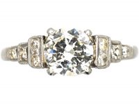 Art Deco Platinum Solitaire Diamond Ring with Step Cut Shoulders set with Diamonds