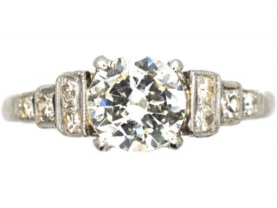 Art Deco Platinum Solitaire Diamond Ring with Step Cut Shoulders set with Diamonds
