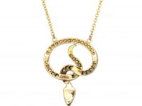 Edwardian Snake Pendant set with Diamonds with Green Garnet Eyes on a Gold Chain