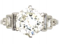 Art Deco Platinum Diamond Solitaire Ring with Step Cut Baguette Diamond Shoulders